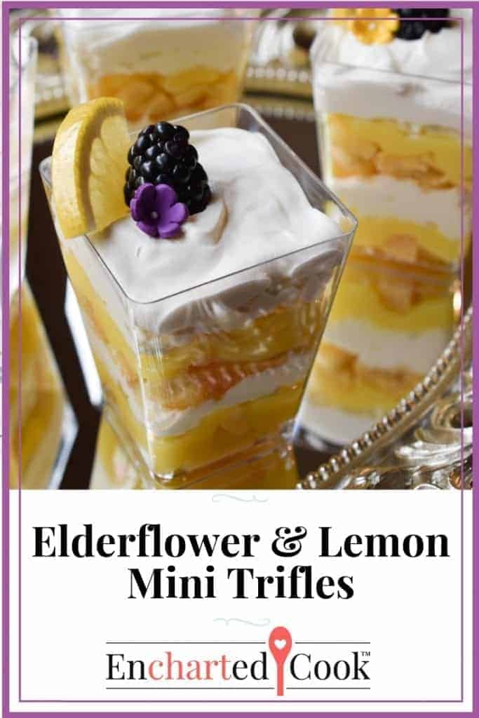 Beautiful Elderflower and Lemon Mini Trifles, layered dessert in individual clear, square tumblers. on a fancy mirrored tray.