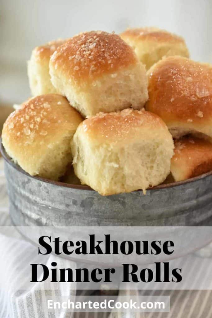 Dinner rolls piled in a galvanized serving tin with a pale grey napkin. Pinterest Pin #4