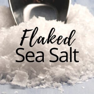 A pile of flaked sea salt and the words "Flaked Sea Salt" are in the middle of the image.