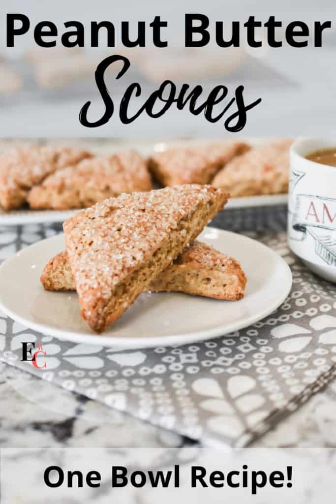 Close view of two scones on a white plate and a grey napkin. The words "Peanut Butter Scones" and "One Bowl Recipe! are in plain and script black lettering. Pinterest Pin-2.