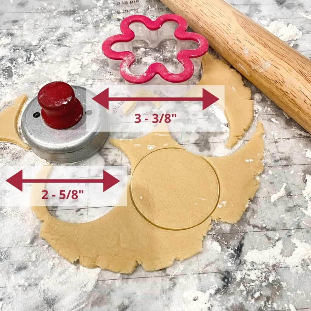 Dough cut with two cutters, round and flower shaped. The dimensions of each cutter is noted on the image. Round = 2-⅝" in diameter and Flower = 3-⅜" in diameter.