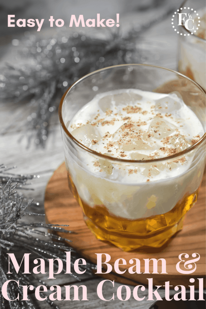 Cocktail on the rocks with a float of cream and a dusting of nutmeg on a wooden serving board. PIN 4