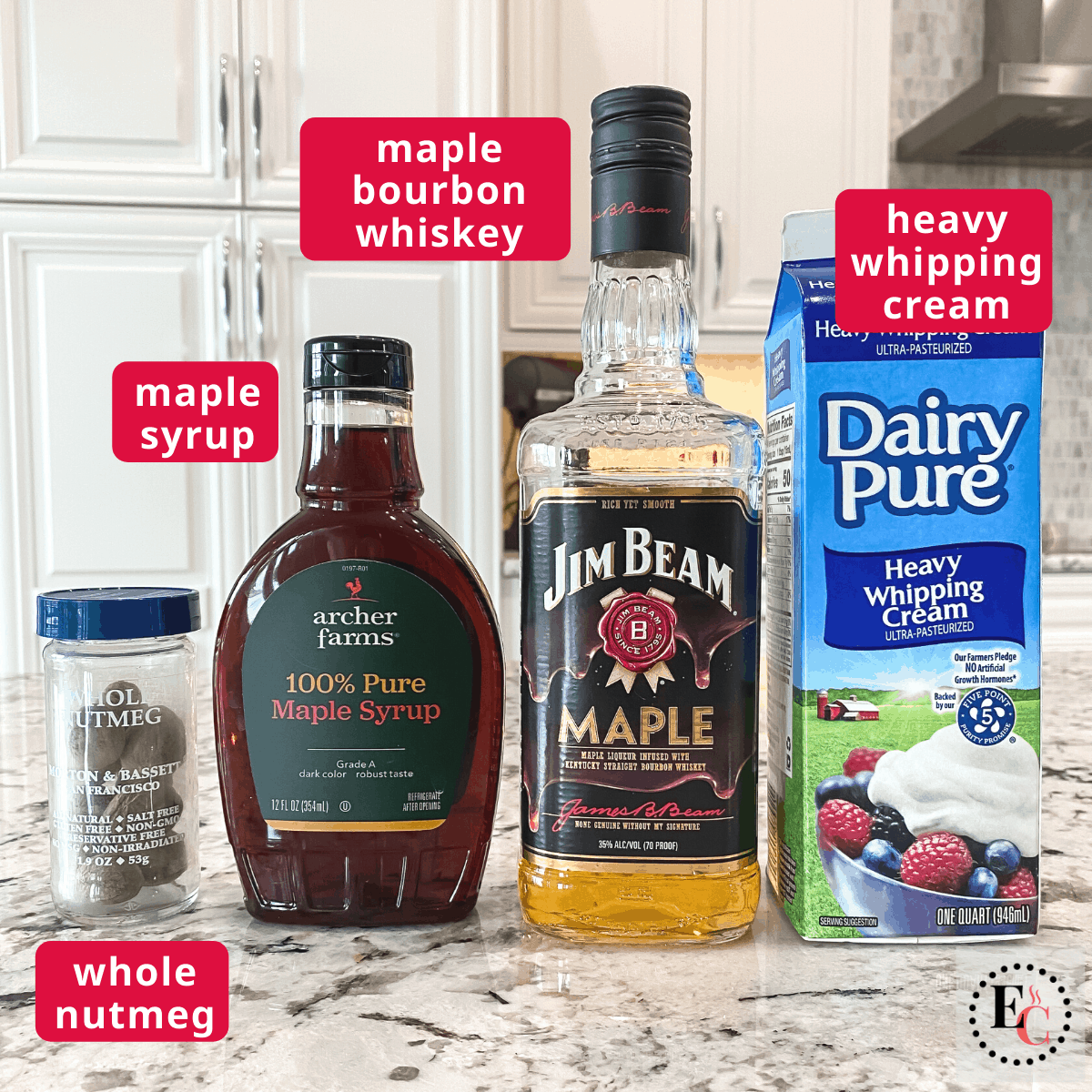 Ingredients for a Jim Beam Maple Bourbon Cocktail, from left to right: whole nutmeg, maple syrup, jim beam maple bourbon, heavy whipping cream.