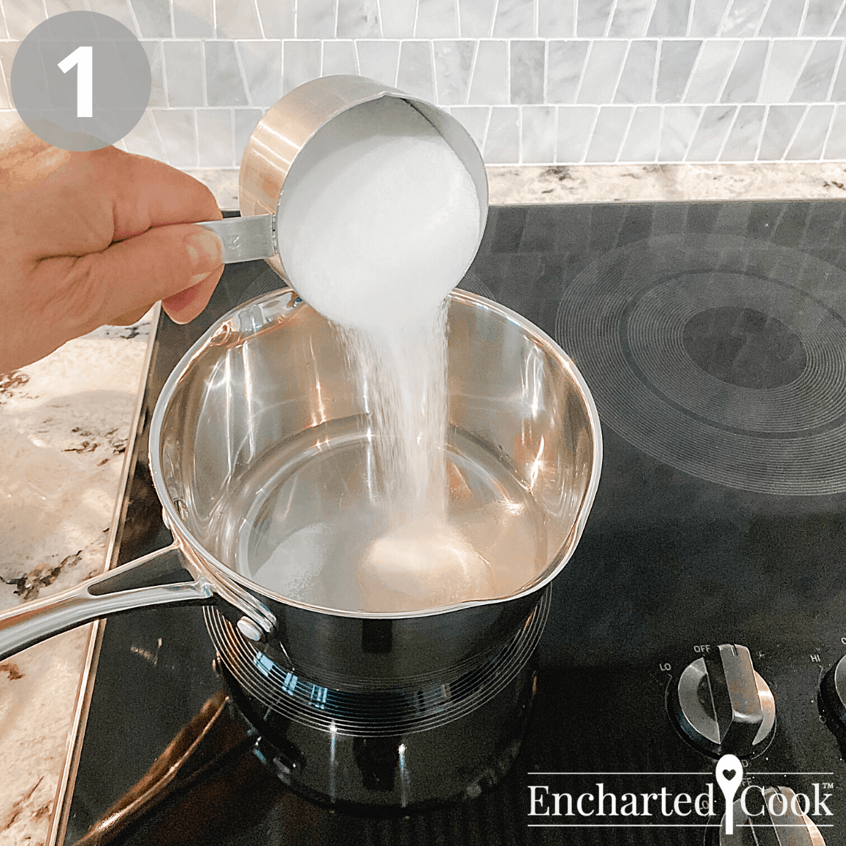 In a small saucepan white granulated sugar is added to water.