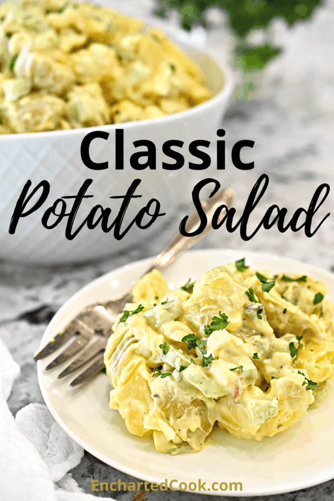 A small white plate with a serving of classic potato salad. A bowl of potato salad is in the background.