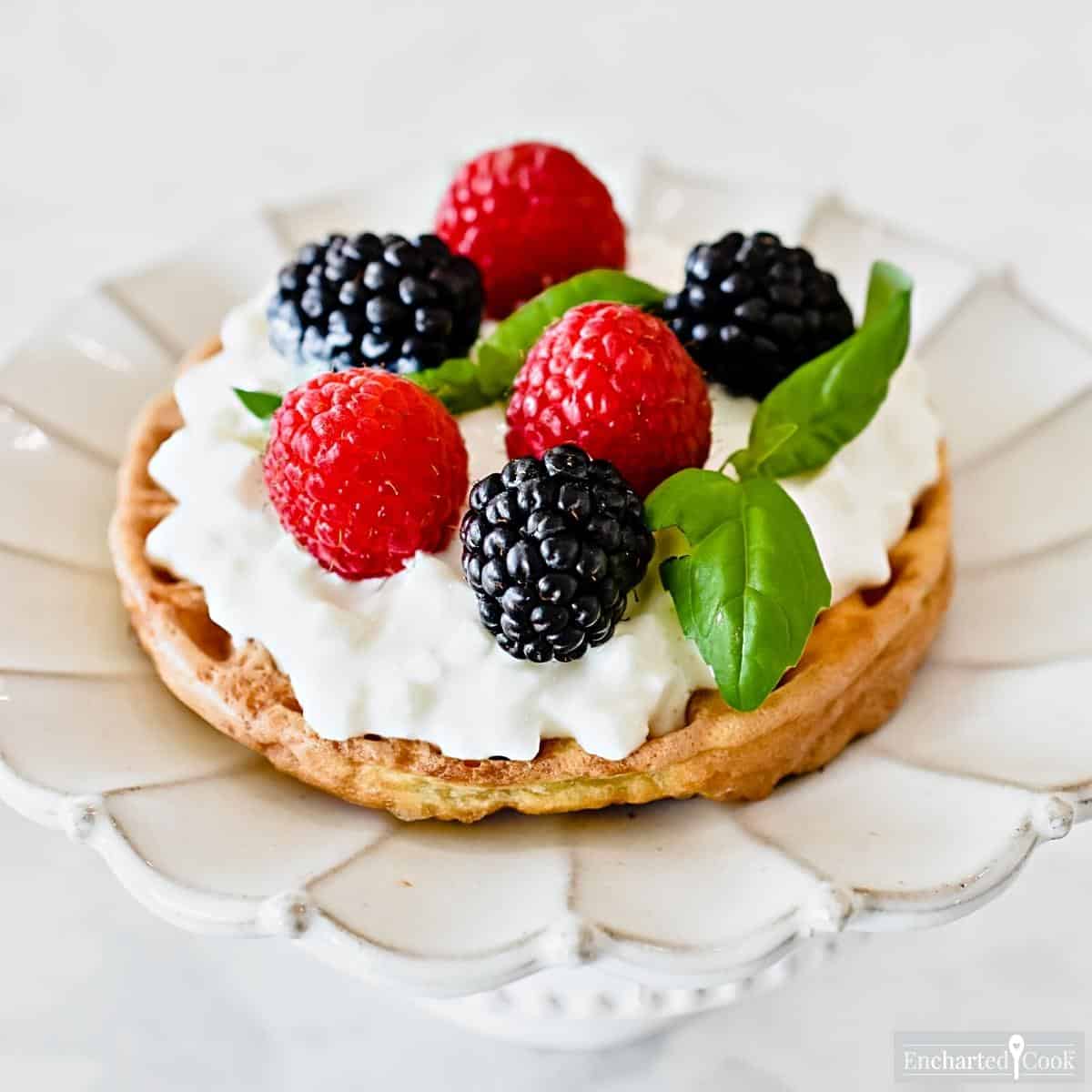 Cottage cheese and berries on a cheese waffle.