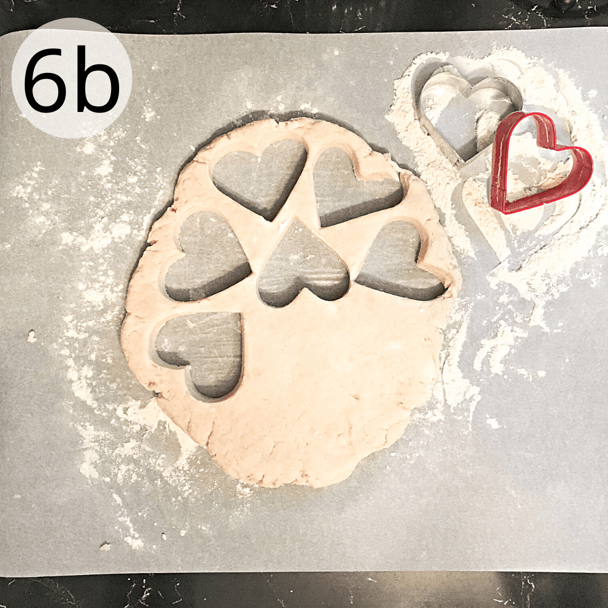 Cutting the scone dough with a heart shaped cutter.