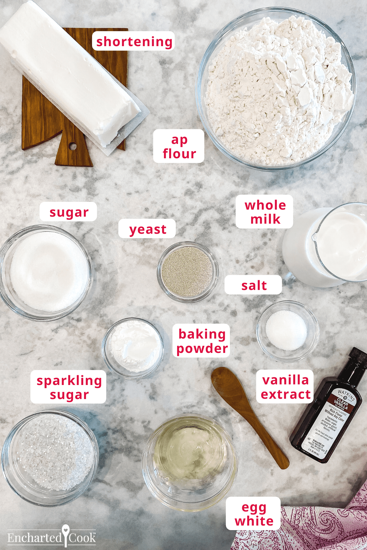 The ingredients clockwise from top left: shortening, ap flour, whole milk, salt, vanilla extract, egg white, sparkling sugar, baking powder, yeast, sugar.