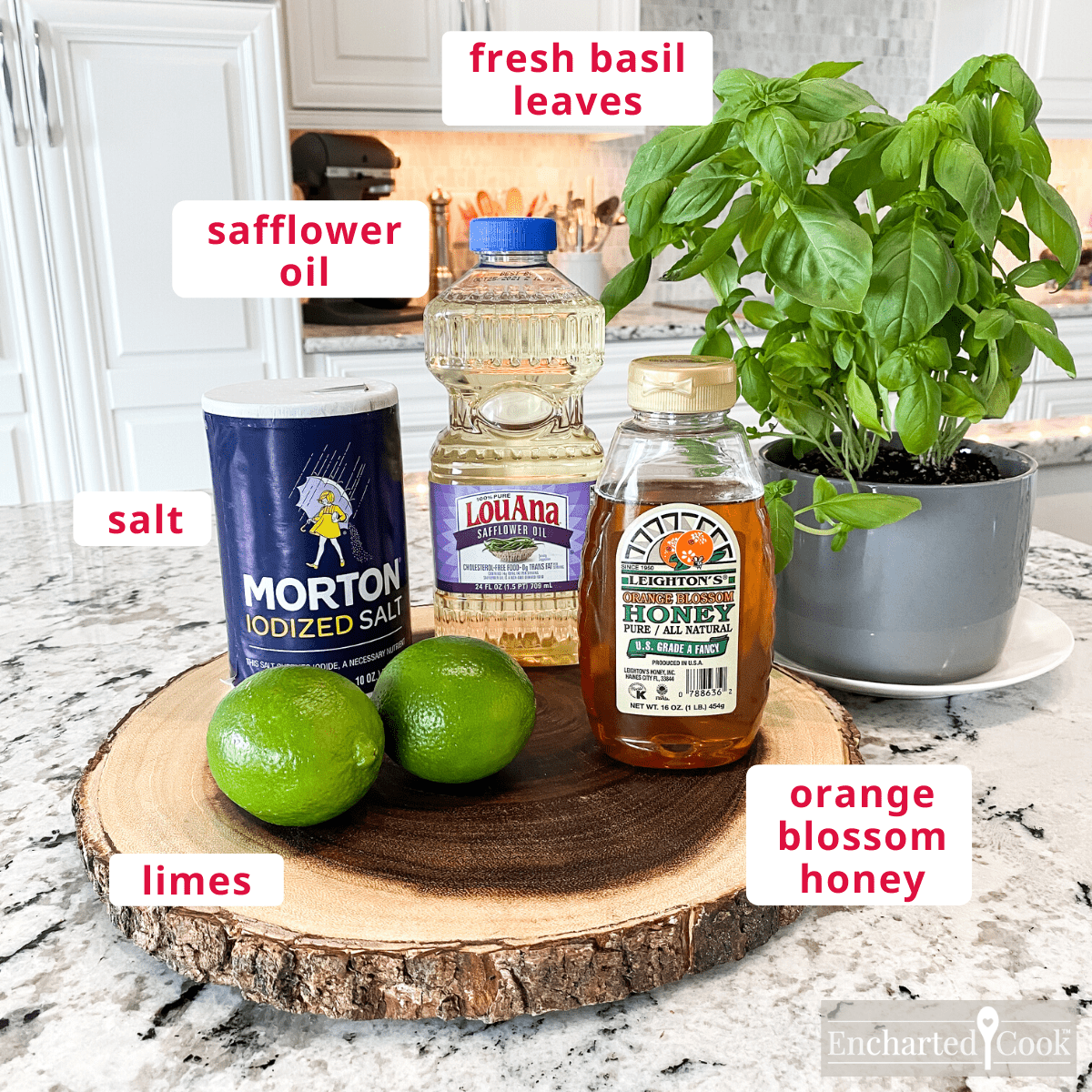 Dressing ingredients, clockwise from top right: fresh basil leaves, orange blossom honey, limes, salt, safflower oil.