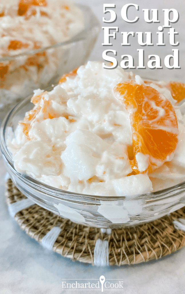 White and orange fruit salad in a small serving dish with text overlay.