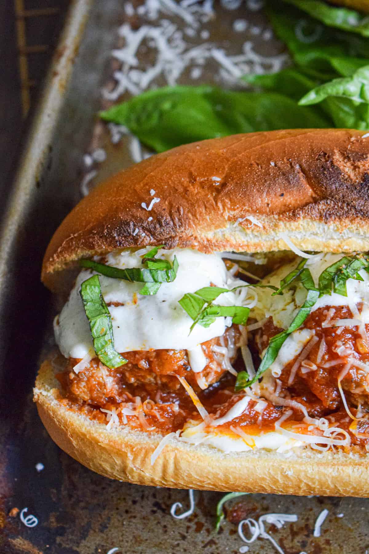 Meatballs in red sauce on a toasted sub roll.