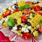 Corn salad in a glass dish.