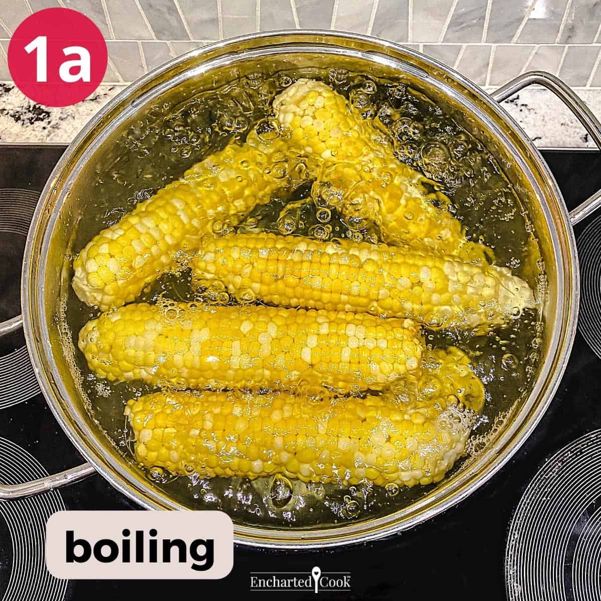 Corn boiling in a large pot on the stove.