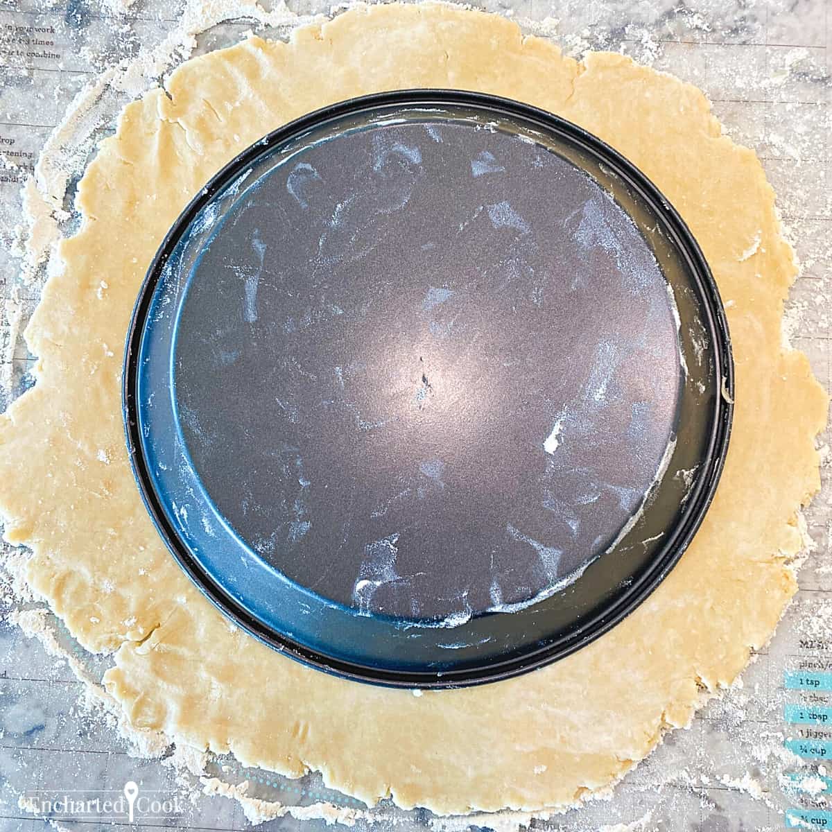 Inverted pie pan to check for size of rolled out pie crust dough.