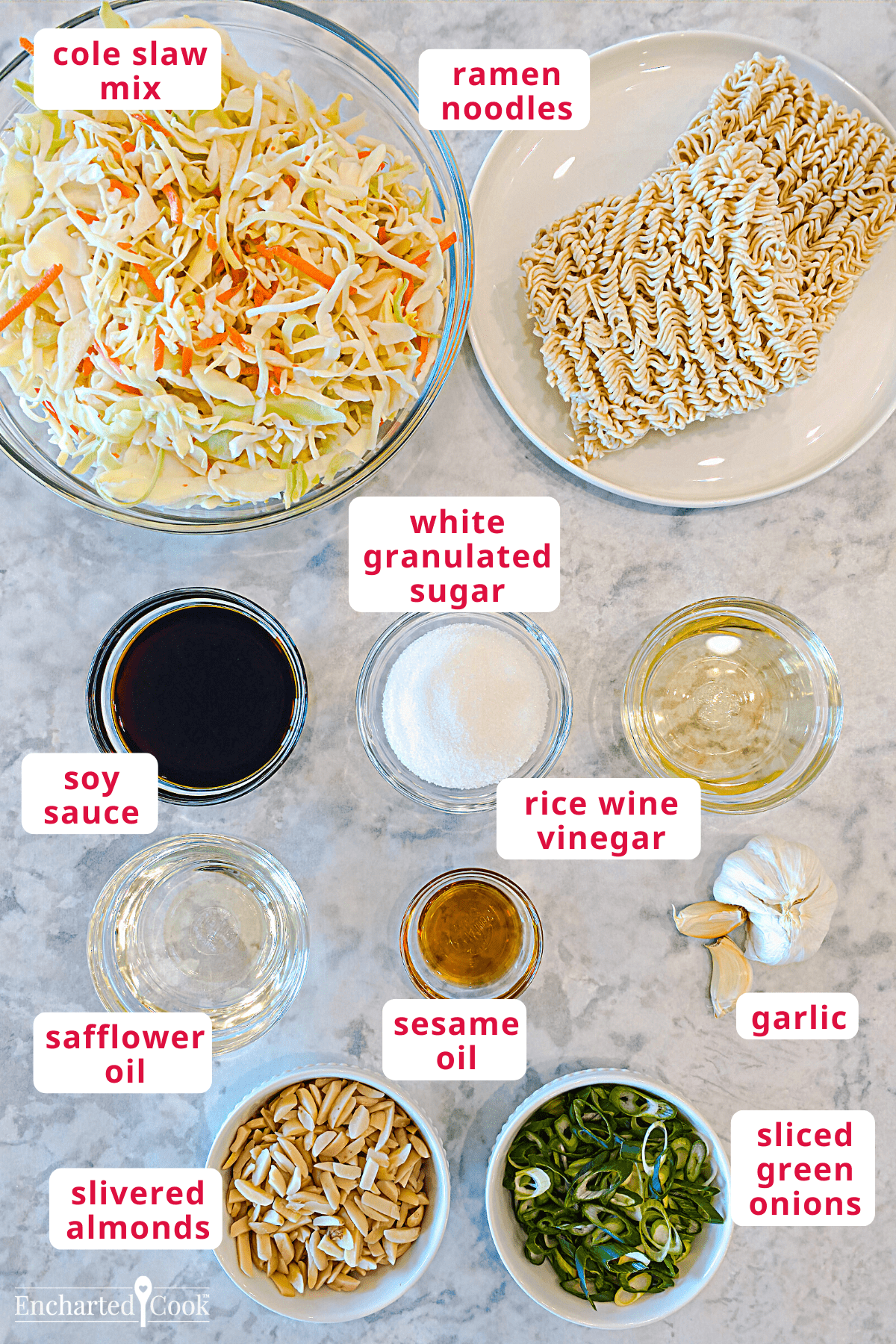 he salad ingredients, clockwise from top right: ramen noodles, white granulated sugar, rice wine vinegar, garlic, sliced green onions, sesame oil, slivered almonds, safflower oil, soy sauce, and cole slaw mix.