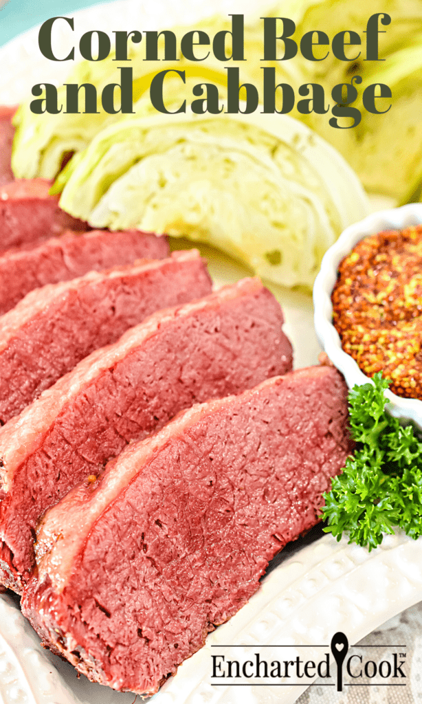 Pink corned beef and green cabbage on a white platter with a dish of whole grain mustard with text overlay.