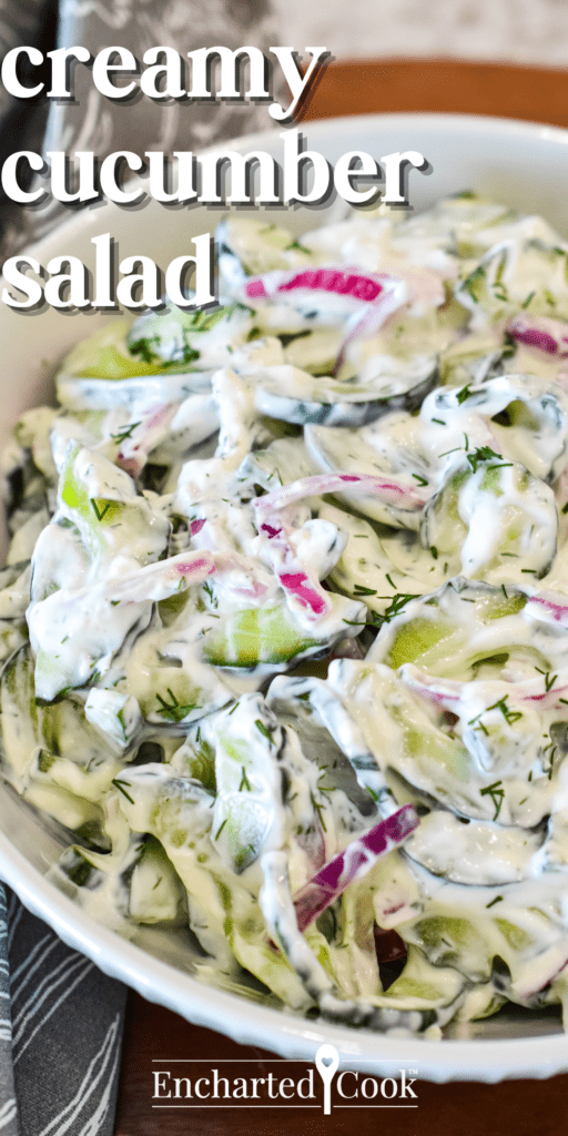 Sliced cucumber and red onion in a creamy dressing in a white bowl with text overlay.
