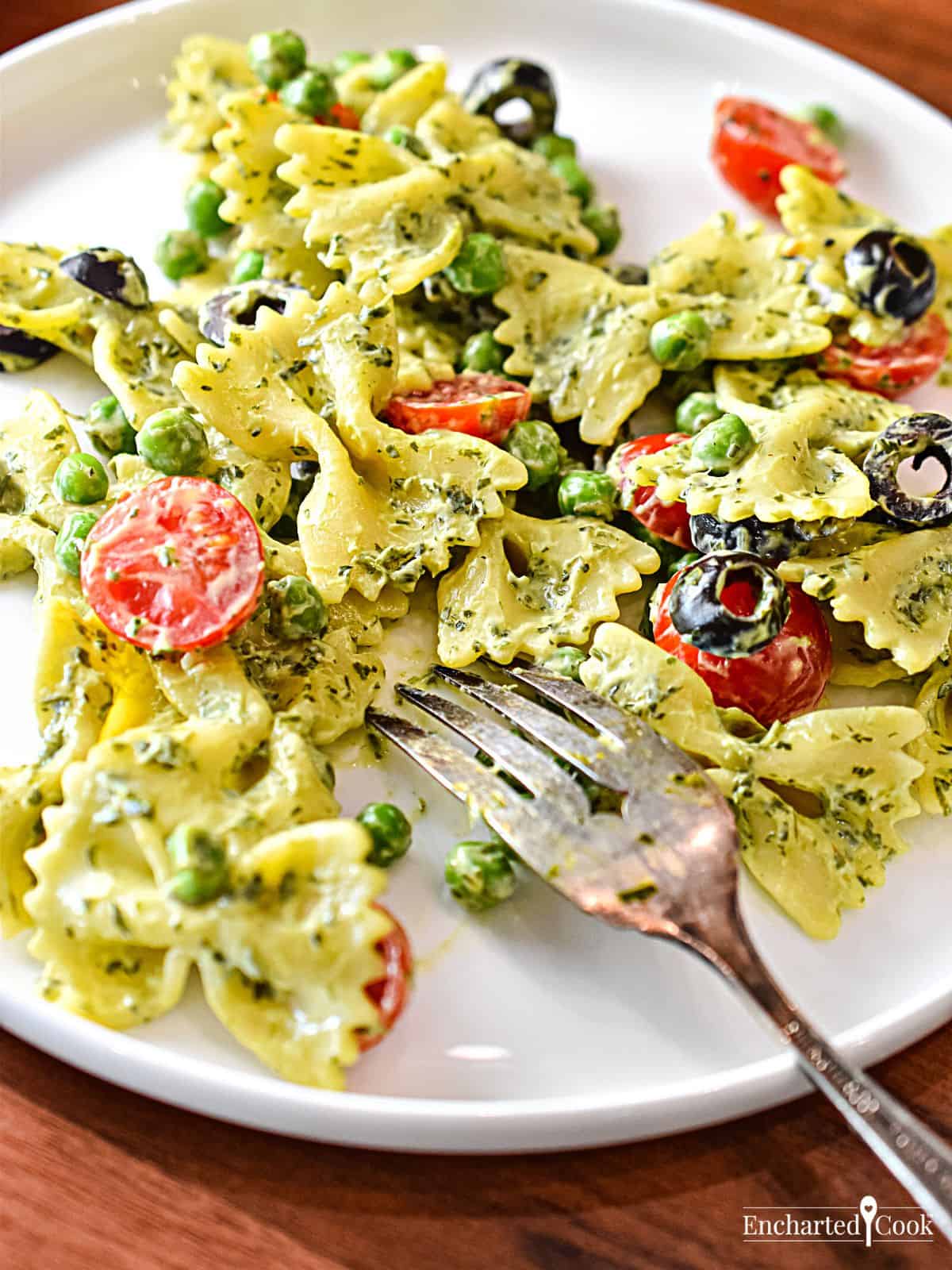 Green Goddess Pasta Salad made with bow tie pasta plated with a fork.