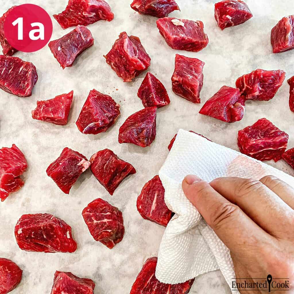 Process Photo 1a - Cubes of beef are dried with a paper towel.