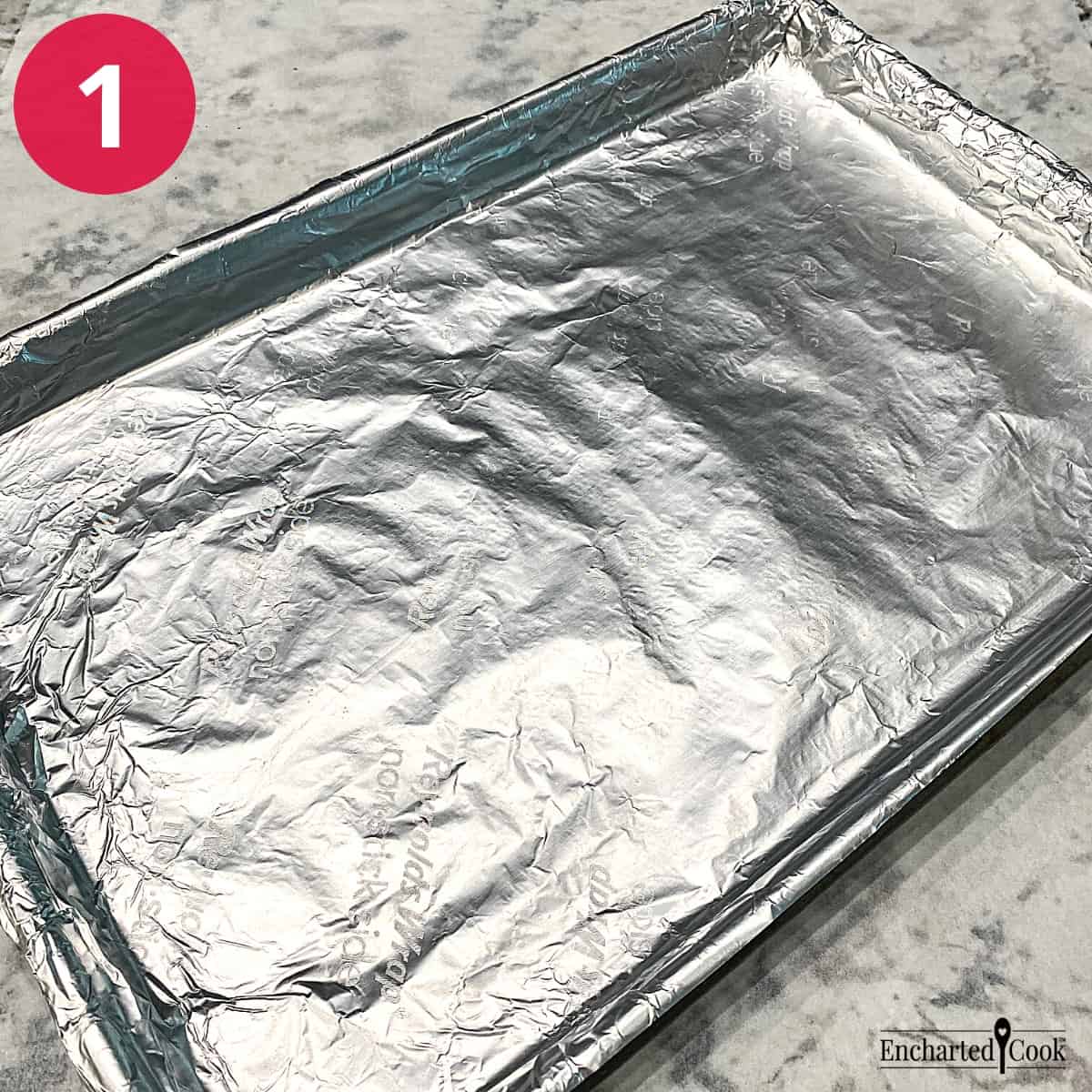 Process Photo 1 - A rimmed baking sheet is lined with aluminum foil.