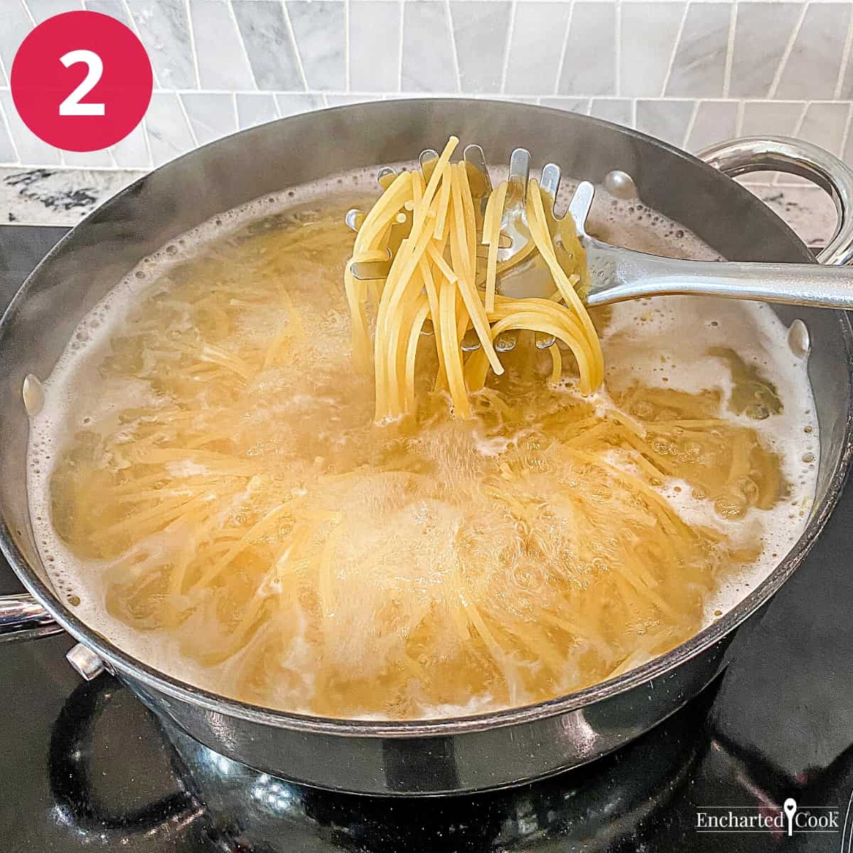 Process Photo 2 - Spaghetti is being boiled in a large pot.