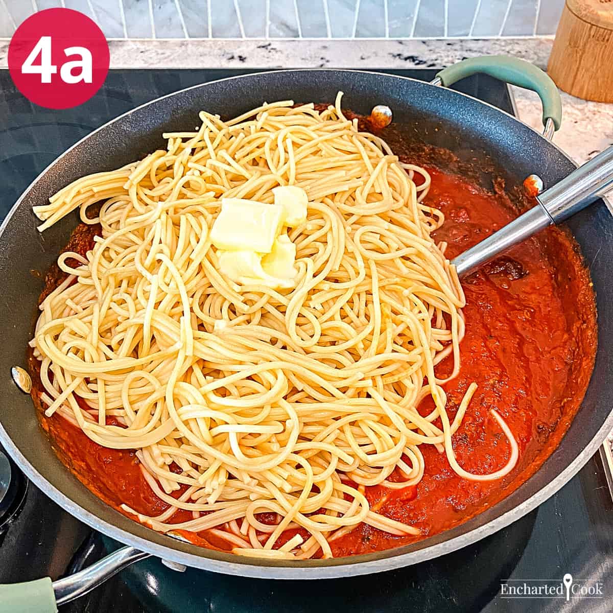 Process Photo 4a - Spaghetti and butter are added to the meaty marinara sauce.