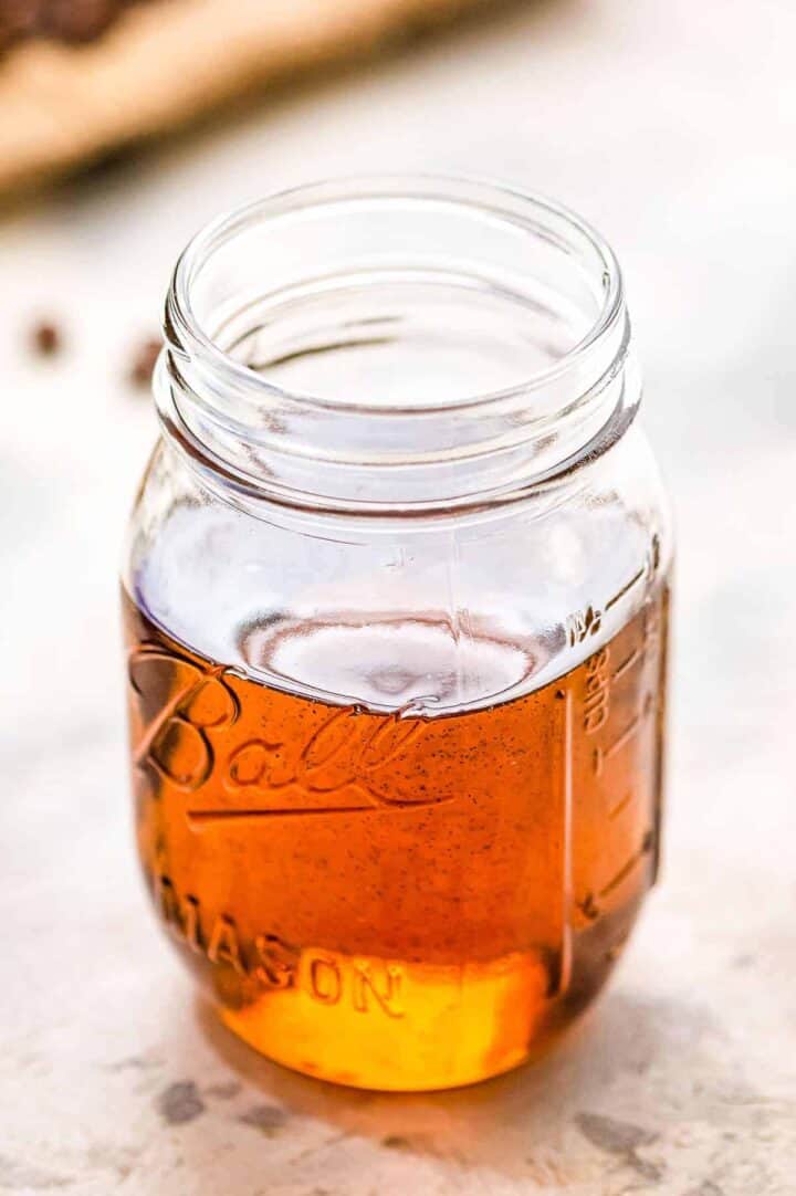 Medium-amber colored syrup in a large Ball canning jar.