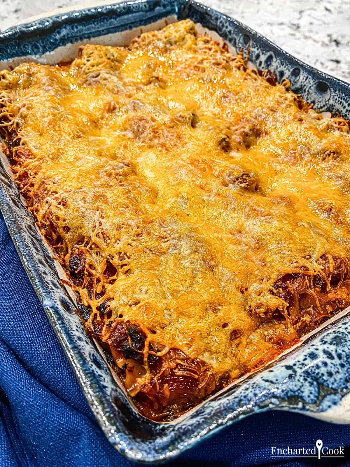 Layered lasagna with lots of melted cheese freshly removed from the oven.