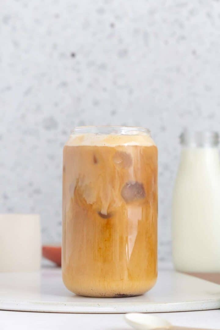 Iced coffee with cream in a tall glass.