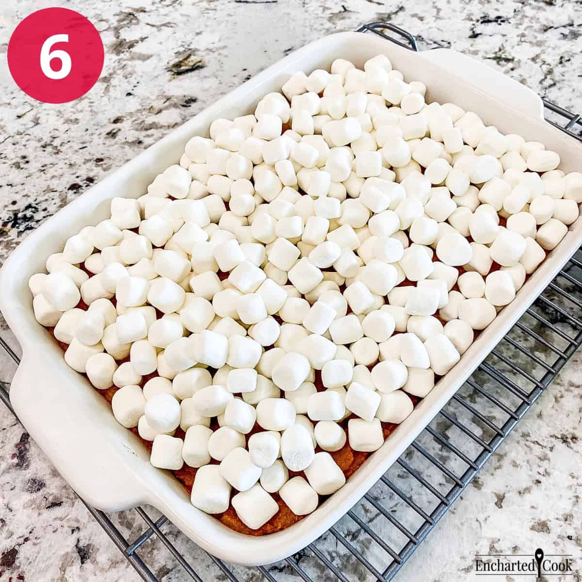 Process Photo 6 - Miniature marshmallows are placed on top of the baked sweet potatoes and ready to be toasted in the oven.