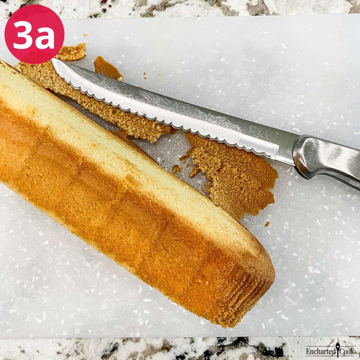 Process Photo 3a - The brown sides and edges of the pound cake is trimmed away with a serrated knife.