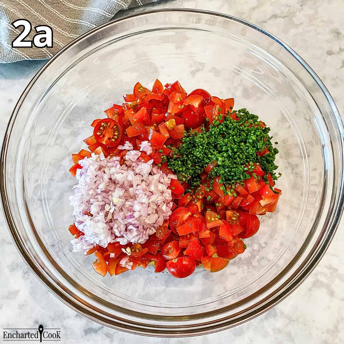 Process Photo 2a - Adding the chopped cherry tomatoes, minced shallot, and chives to the vinaigrette.