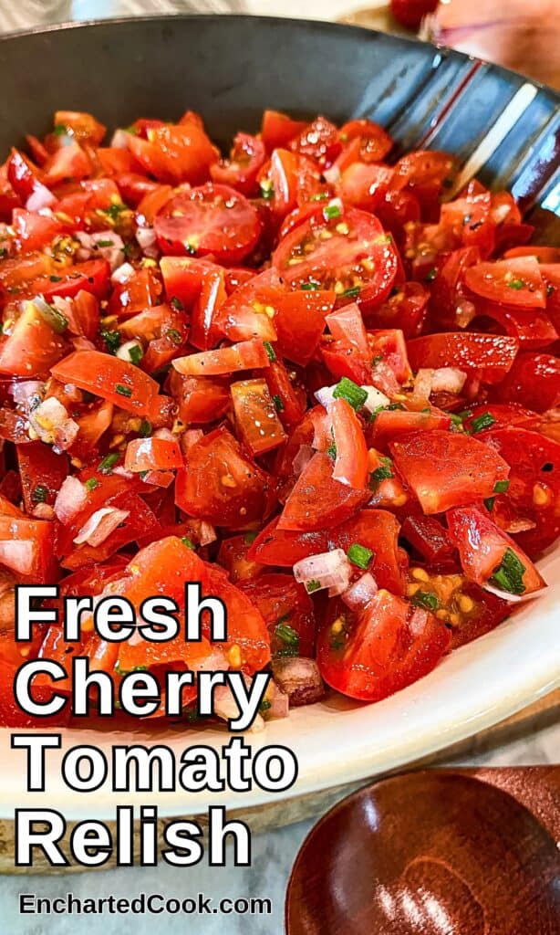 Chopped cherry tomatoes are tossed with chopped shallots, chives, and vinaigrette in a decorative bowl with text overlay.