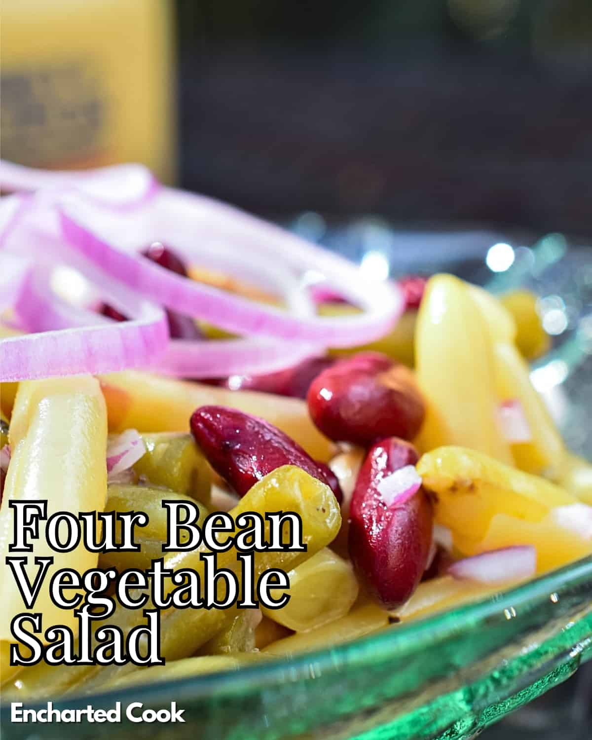 Bean salad on a white platter with text overlay.
