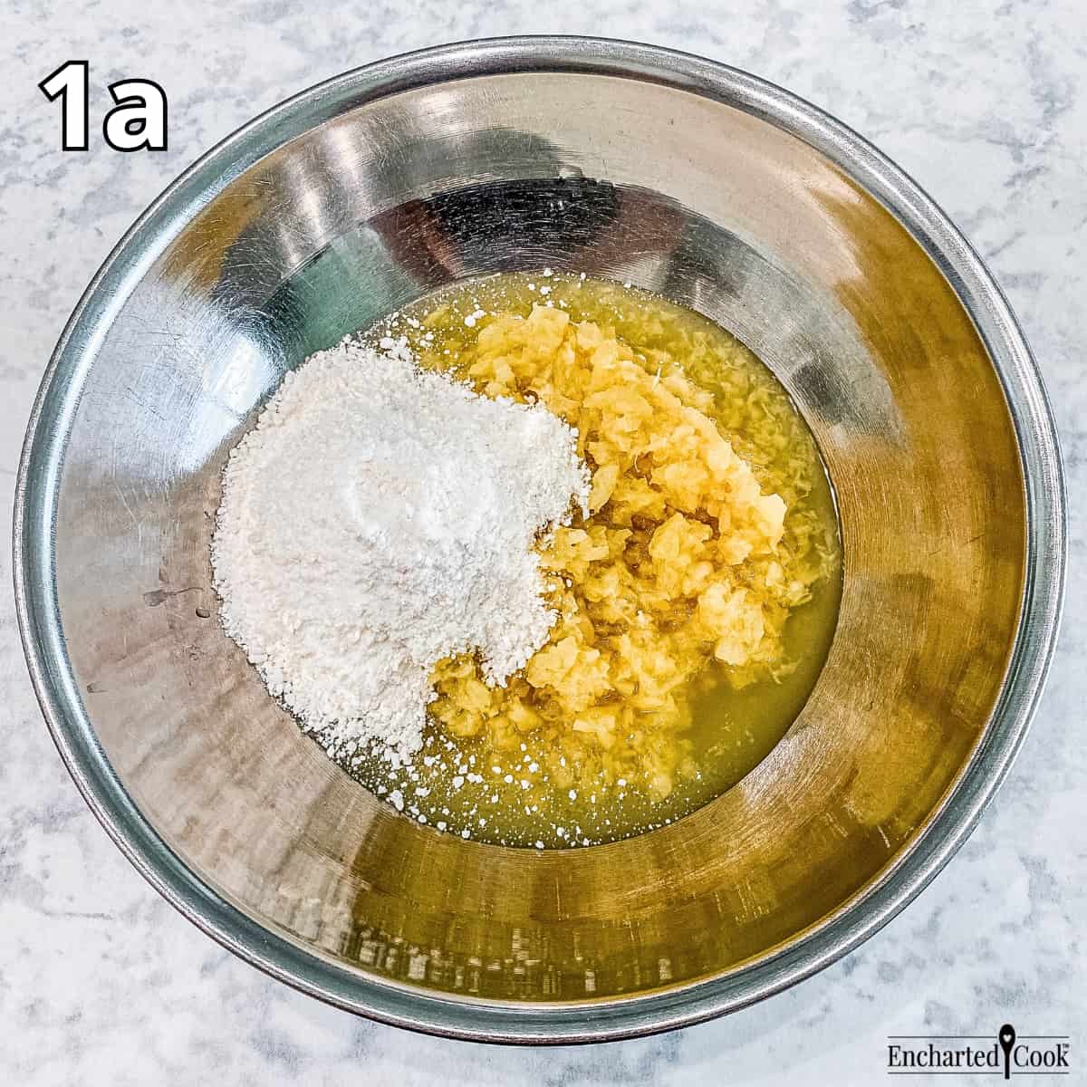 Process Photo 1a - The crushed pineapple and the coconut cream pudding mix in a large bowl.