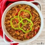 A Tex-Mex style ground beef and rice casserole in a white pan.