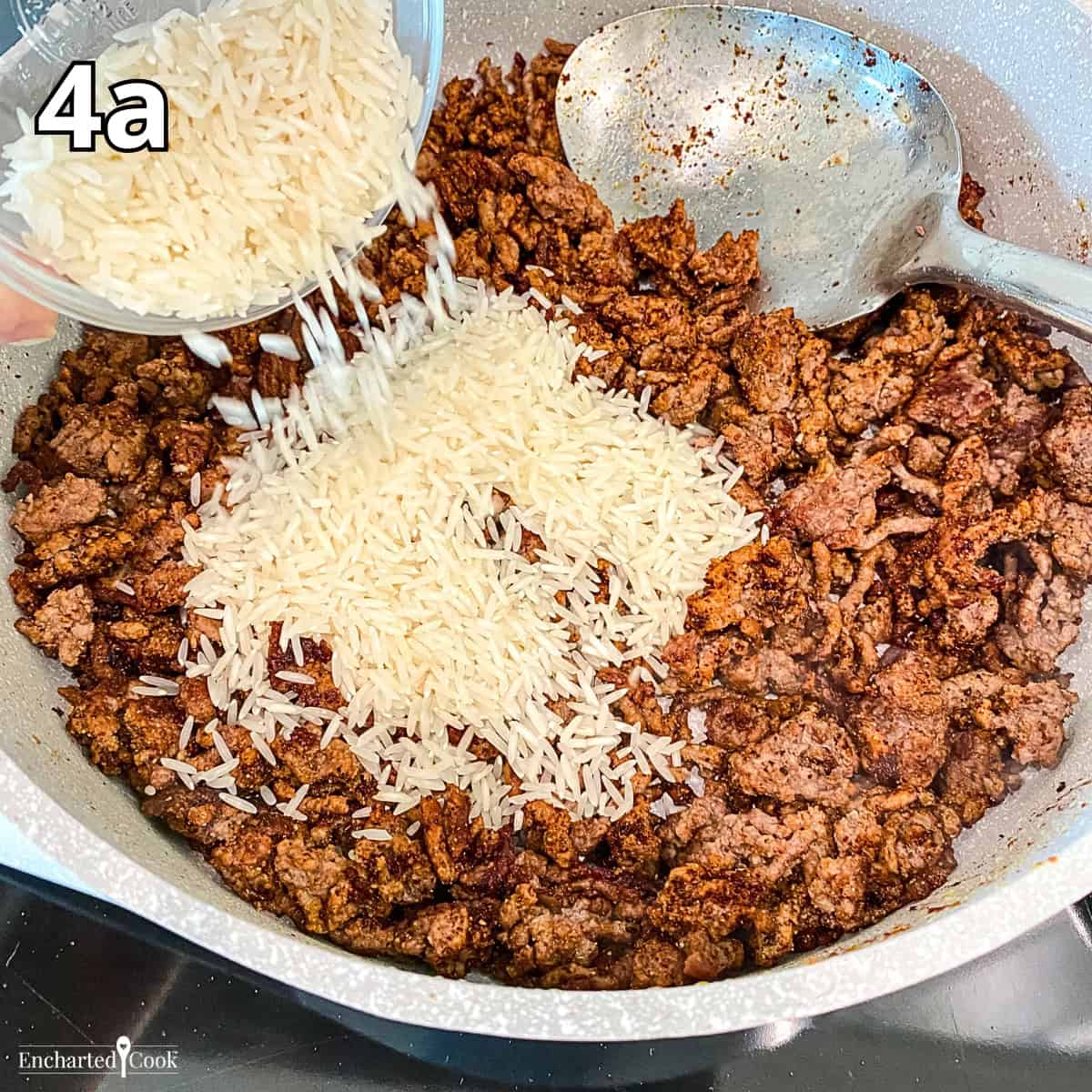 Process Photo 4a - The seasonings and rice are added to the browned ground beef and lightly toasted.