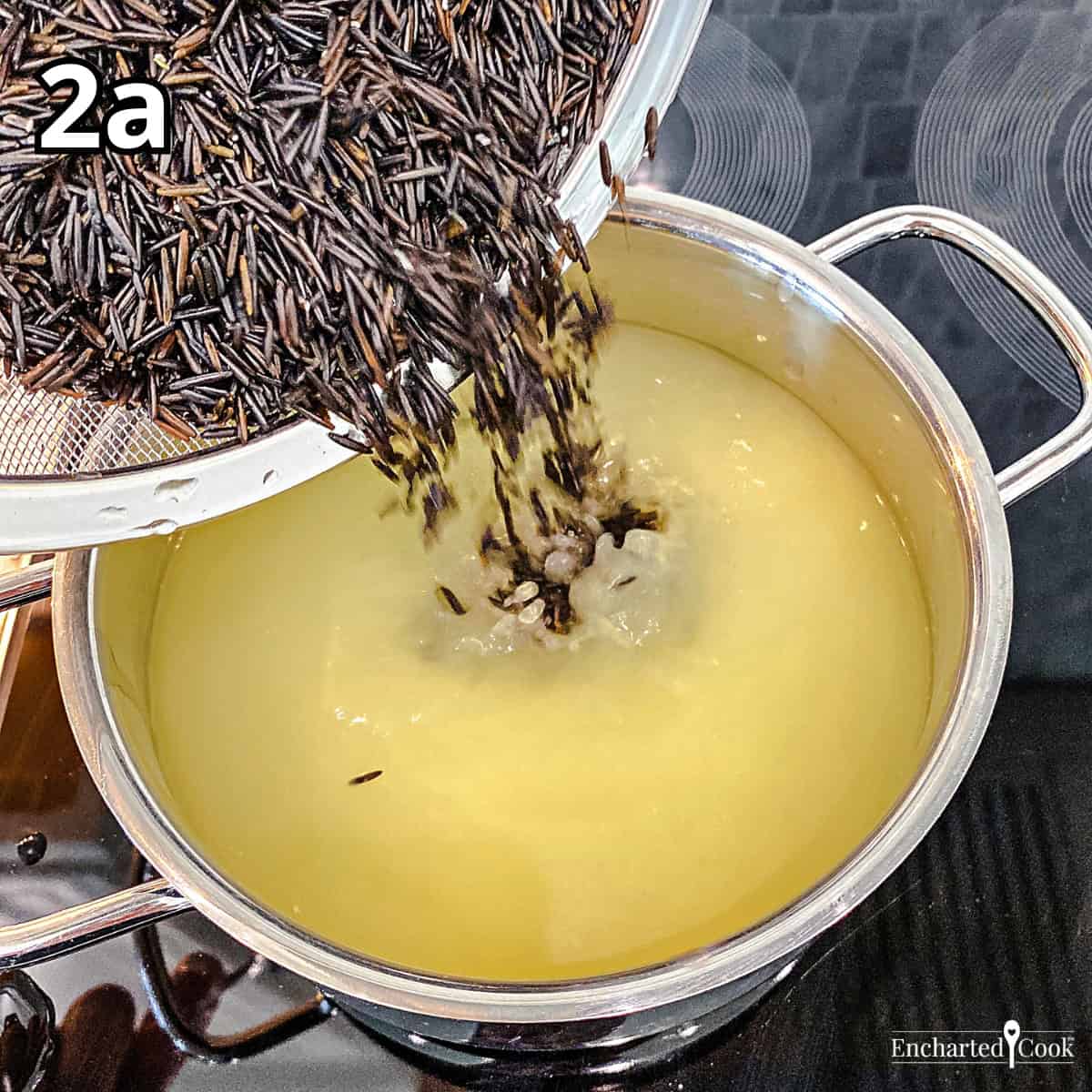 Process Photo 2a - Adding rinsed wild rice to a pot of broth and water.