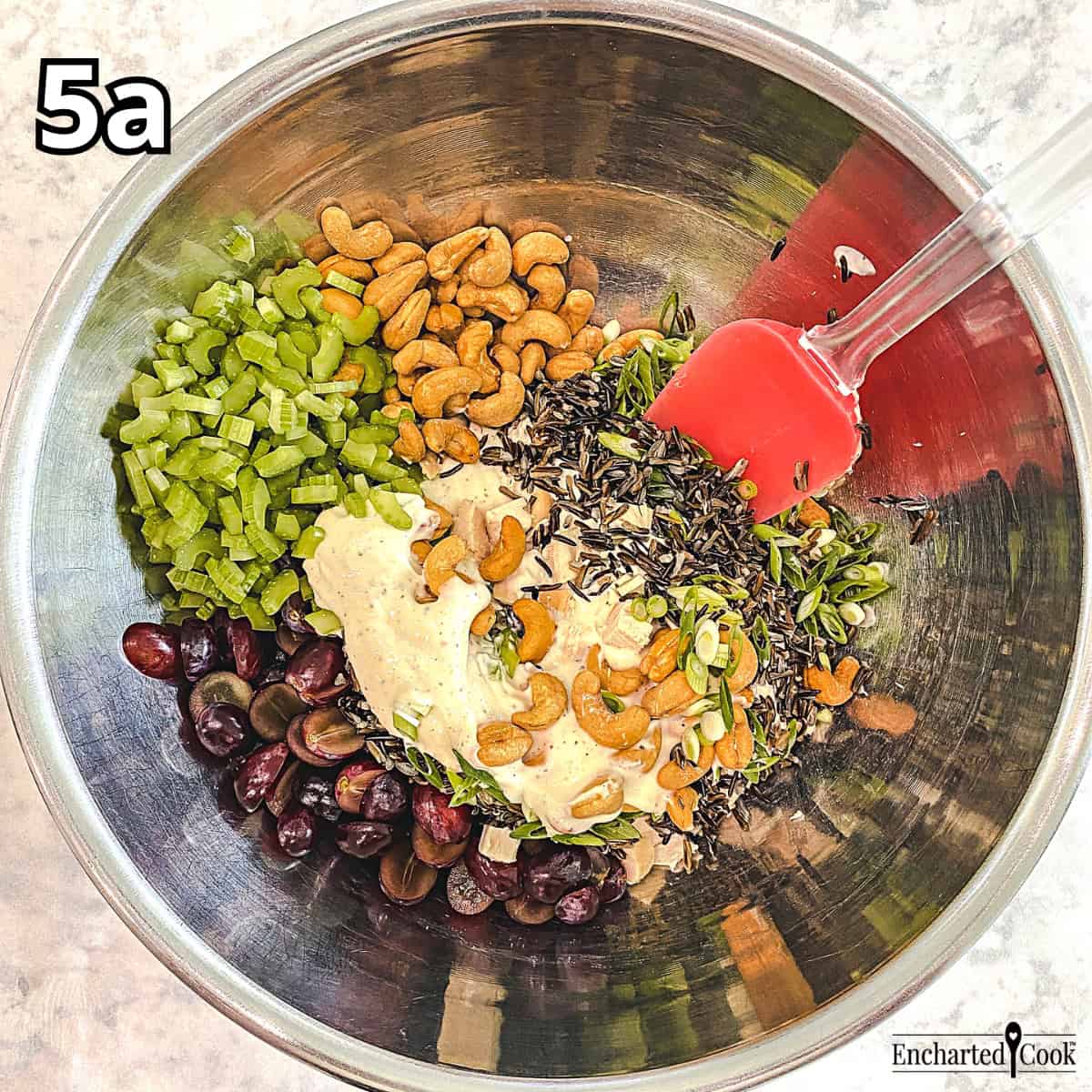 Process Photo 5a - The salad dressing is added to the salad ingredients in a large bowl.