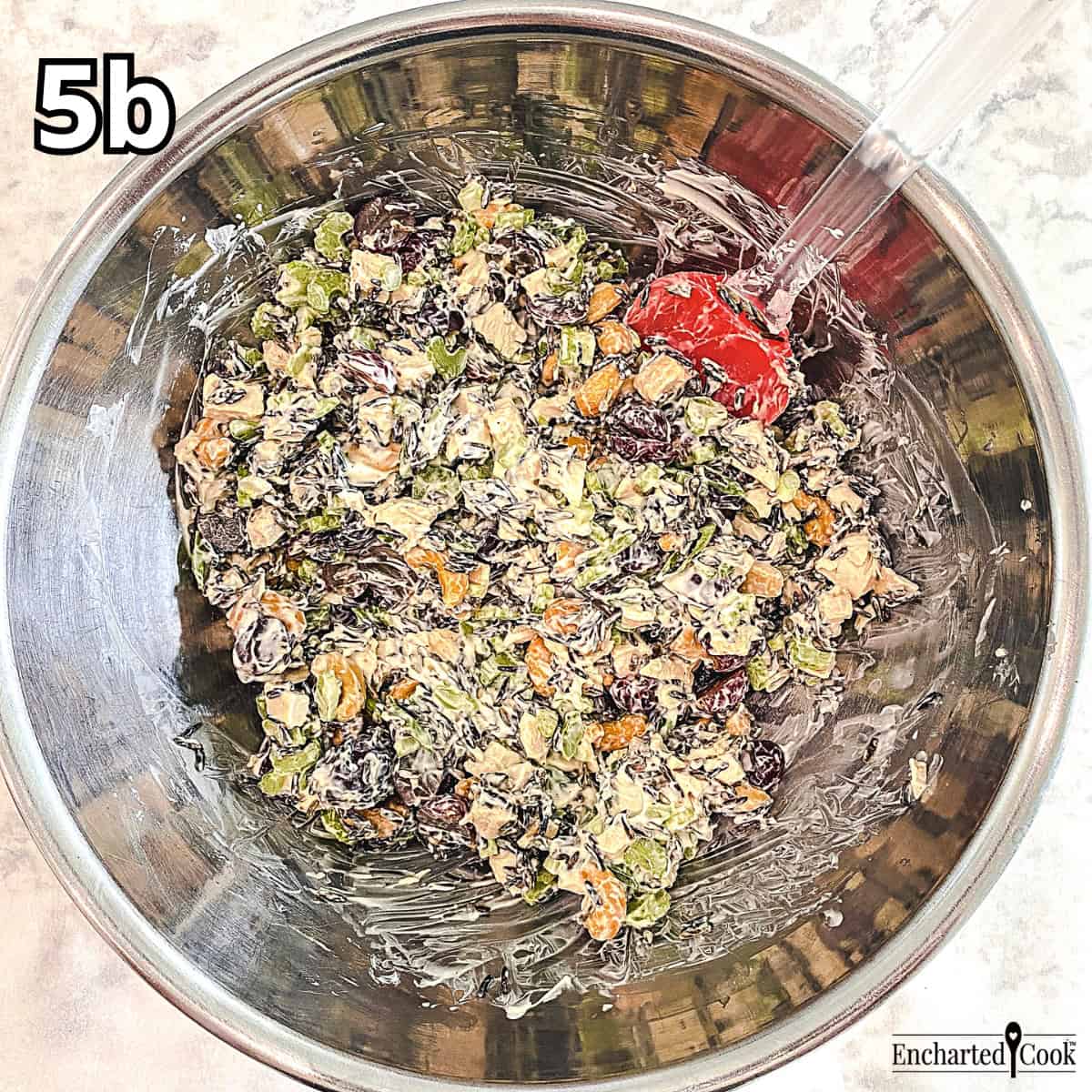 Process Photo 5b - The salad and the dressing are folded together in a large bowl with a silicone spatula.