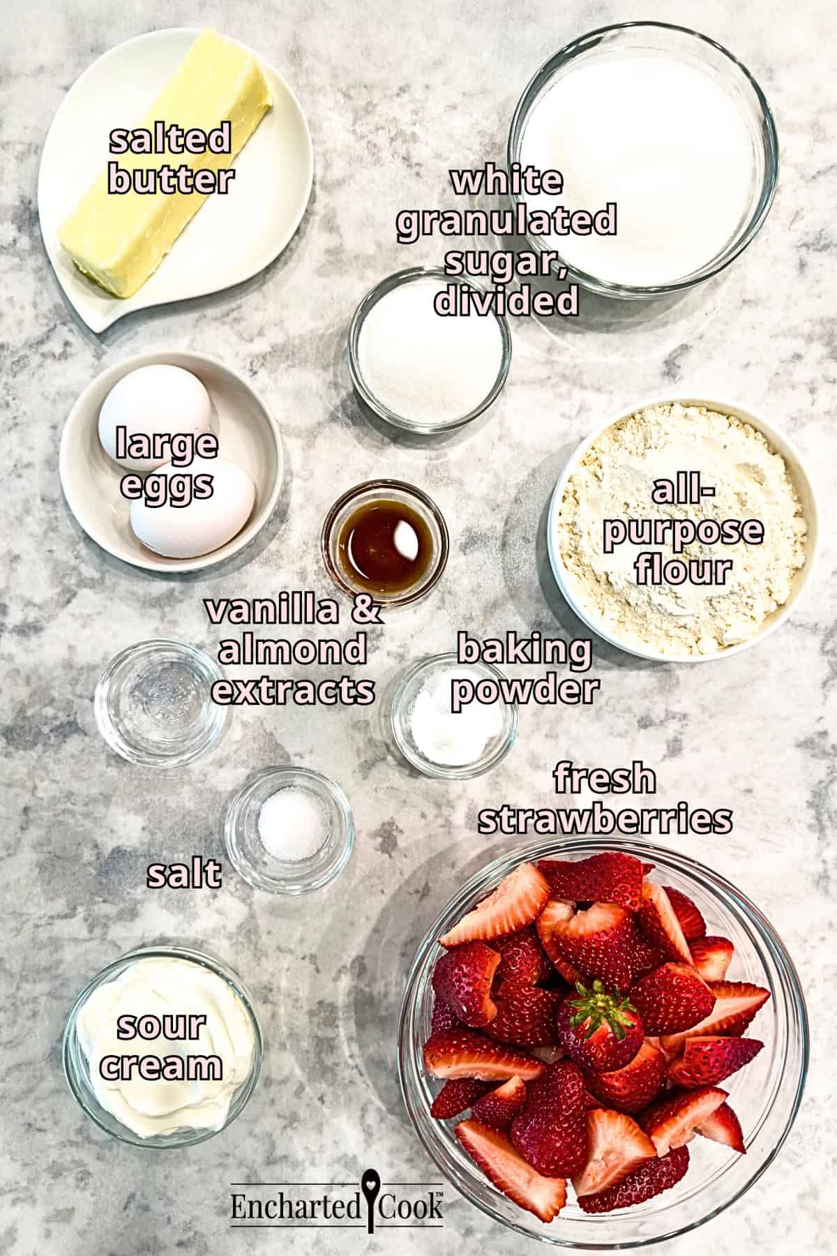Strawberry French Butter Cake Ingredients, clockwise from to left: salted butter, white granulated sugar, all-purpose flour, baking powder, fresh strawberries, sour cream, salt, vanilla and almond extracts, and large eggs.