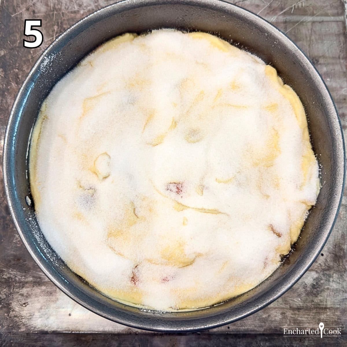 Process Photo 5 - The cake batter is spread into the prepared springform pan and sugar is sprinkled over the top.