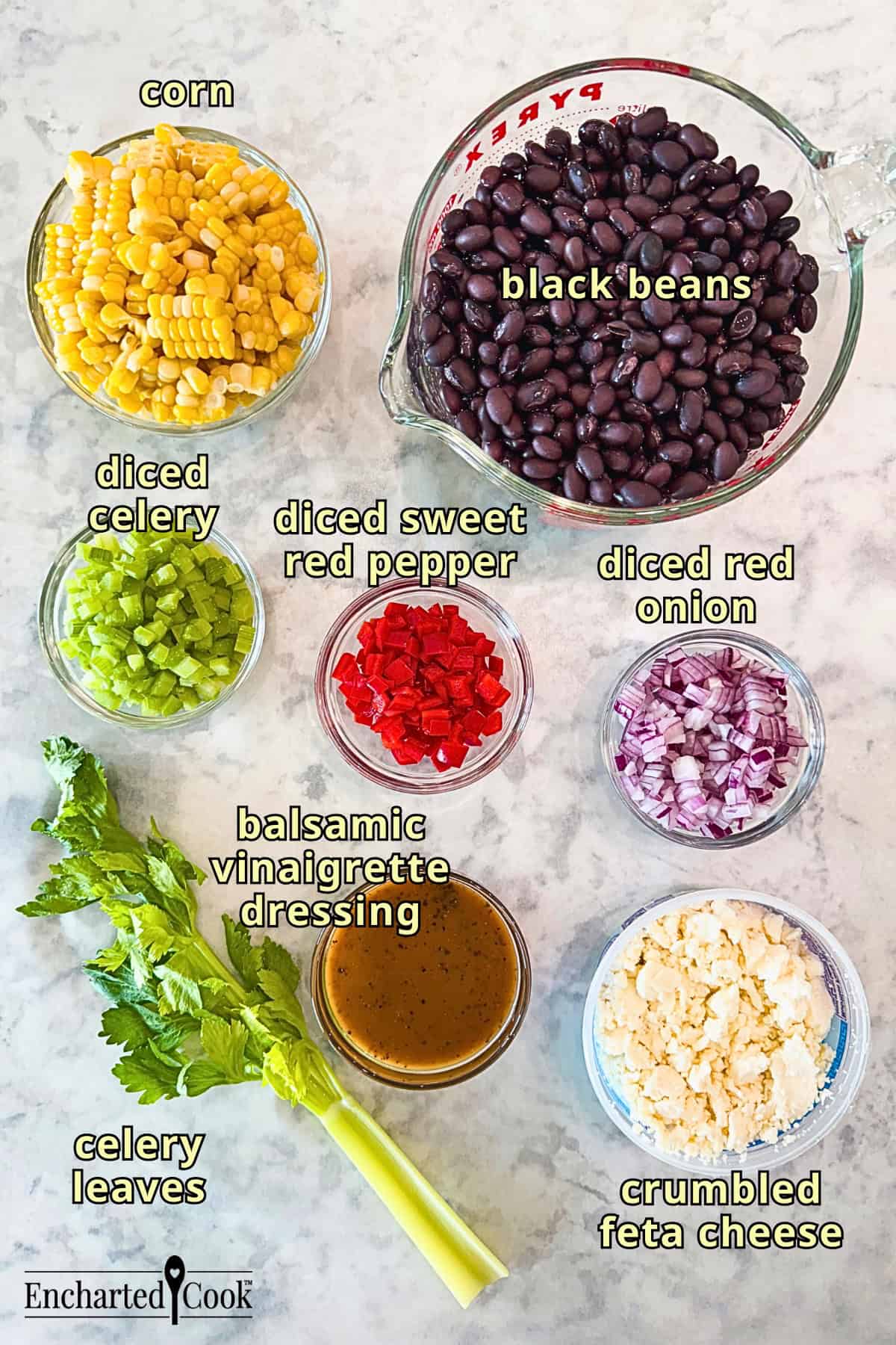Black Bean Salad with Corn Ingredients, clockwise from top right: black beans, diced red pepper, diced red onion, crumbled feta cheese, celery leaves, balsamic vinaigrette, diced celery, and corn.