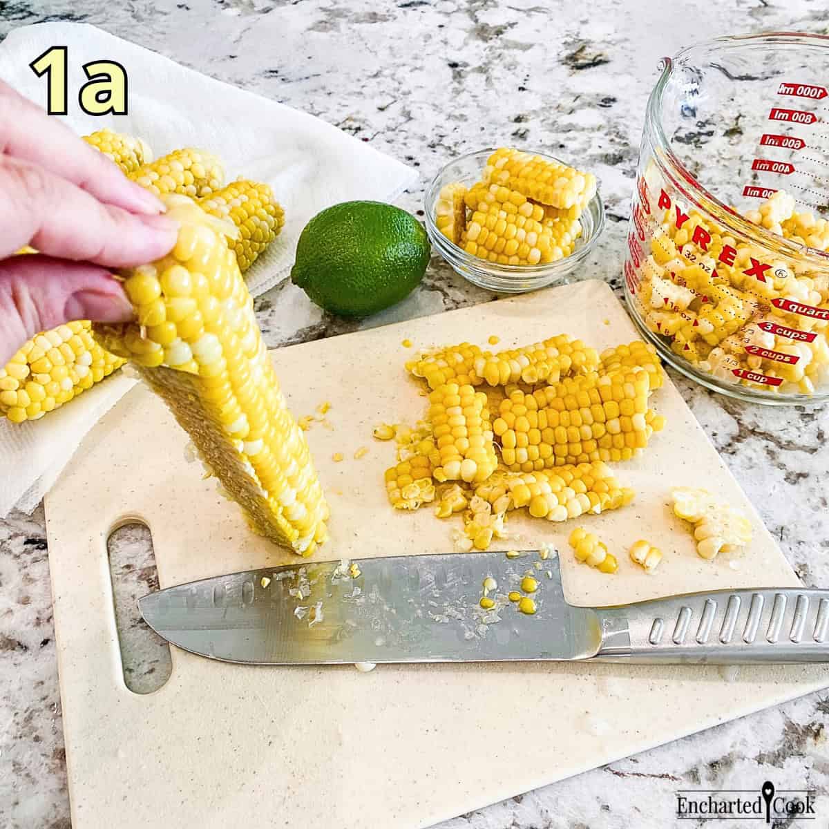 Process Photo 1a - Cutting corn kernels from a cob of corn.