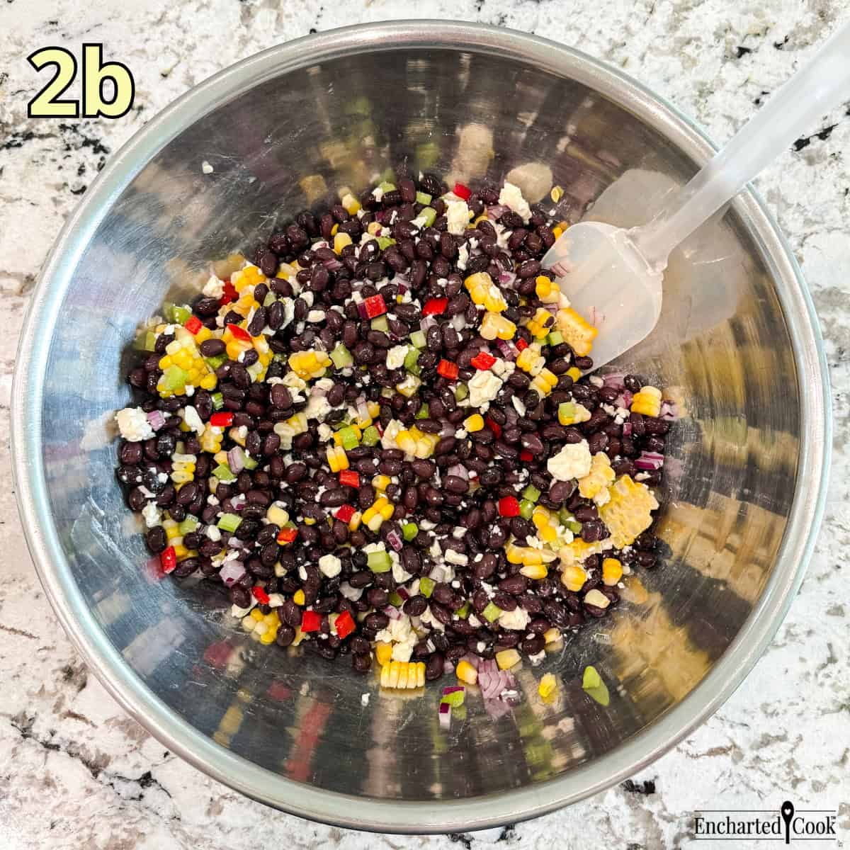Process Photo 2b - Black bean salad ingredients mixed in a large mixing bowl ready to be dressed.
