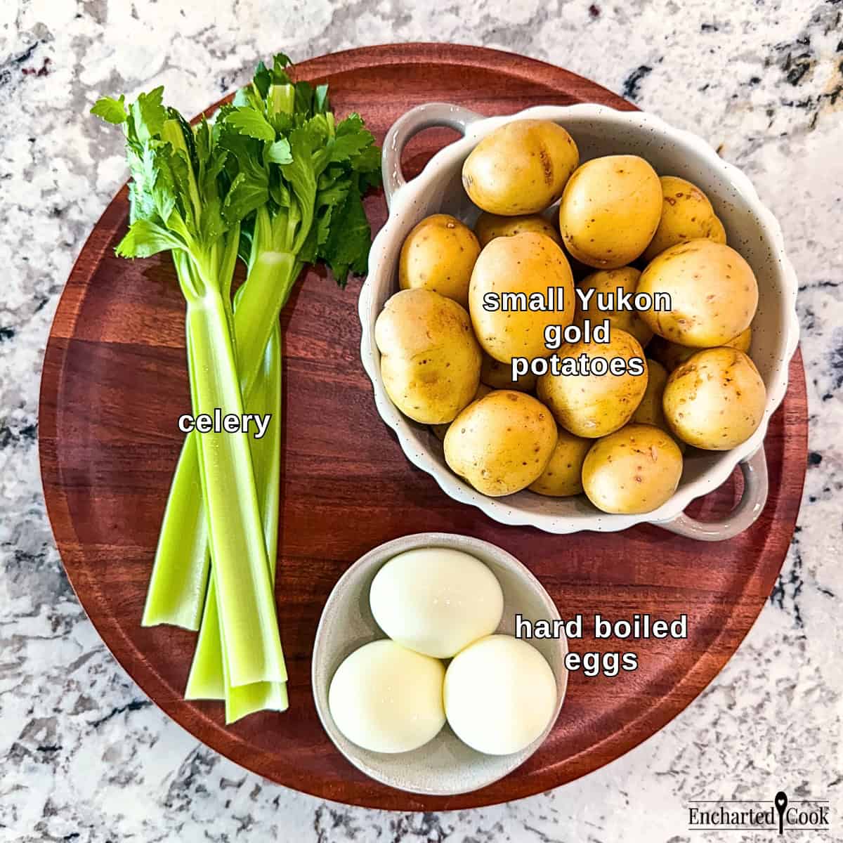 Classic Potato Salad Ingredients, clockwise from top right: small Yukon gold potatoes, hard boiled eggs, and stalks of celery.