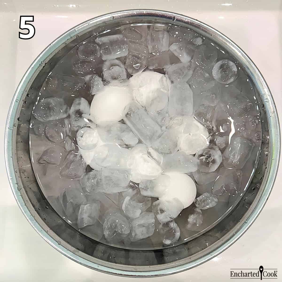 Process Photo 5 - Drain the eggs, rinse with cold water, and place the eggs in ice and water for 12 minutes to cool them and stop the cooking process.