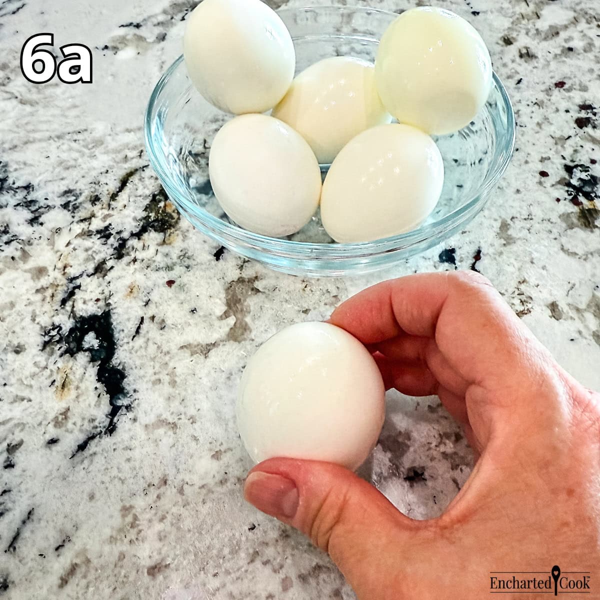 Process Photo 6a - To peel each egg, tap the large bottom of the egg on a hard surface to crack the eggshell.
