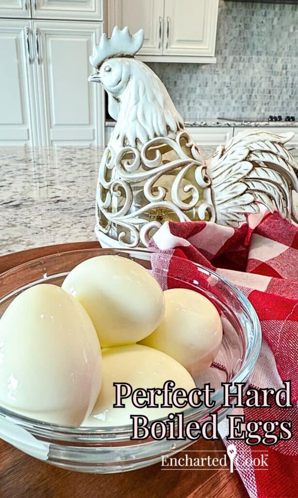 Perfect hard boiled eggs with the eggshell removed and are in a glass bowl with text overlays.