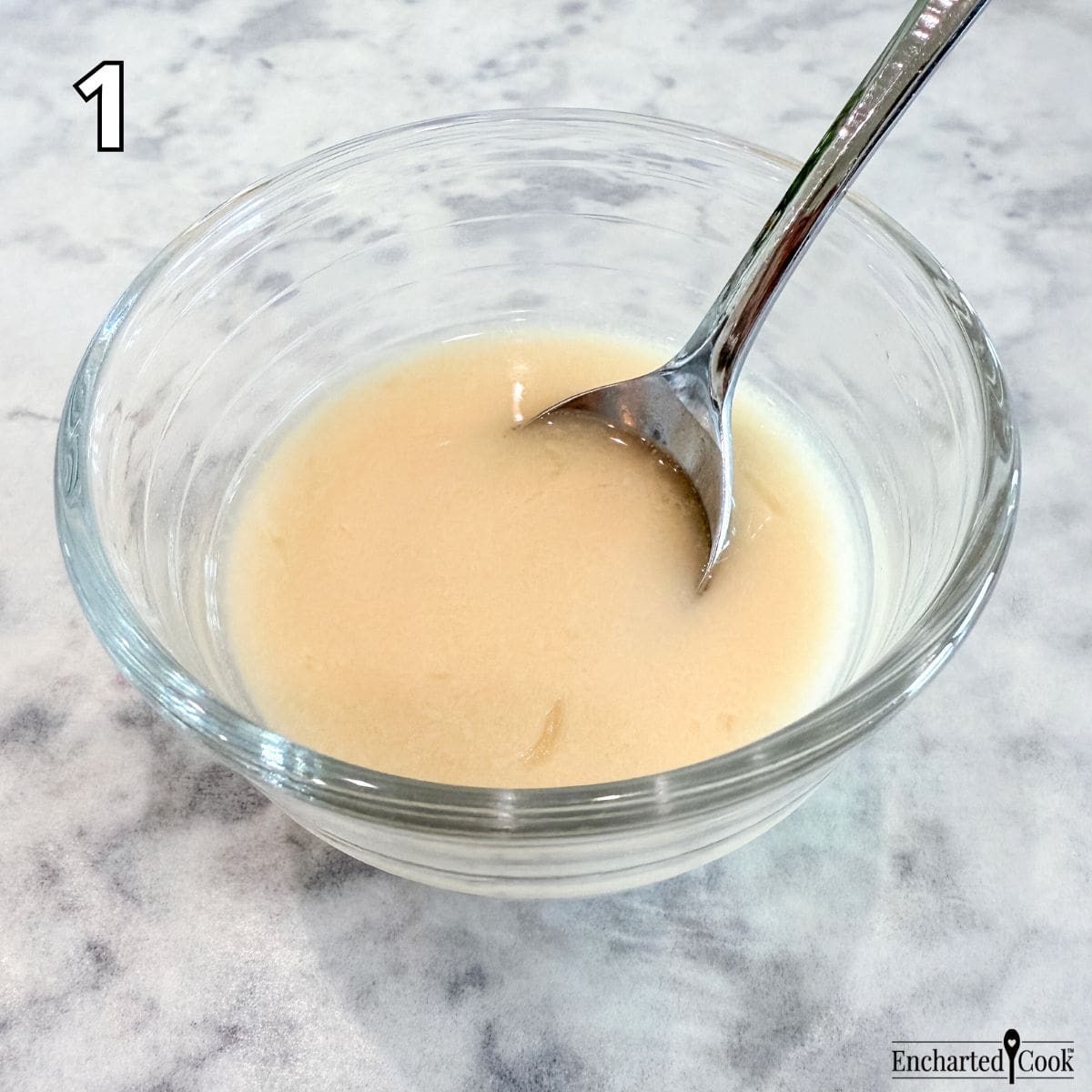 Process Photo 1: An arrowroot slurry is mixed in a small bowl with a spoon.